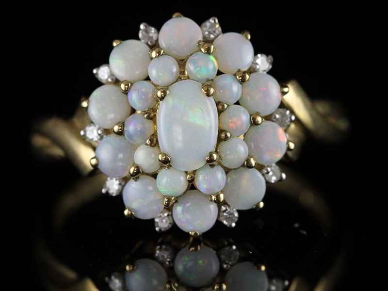 Stunning 21 stone fiery opal and diamond cluster ring in 9 carat gold 