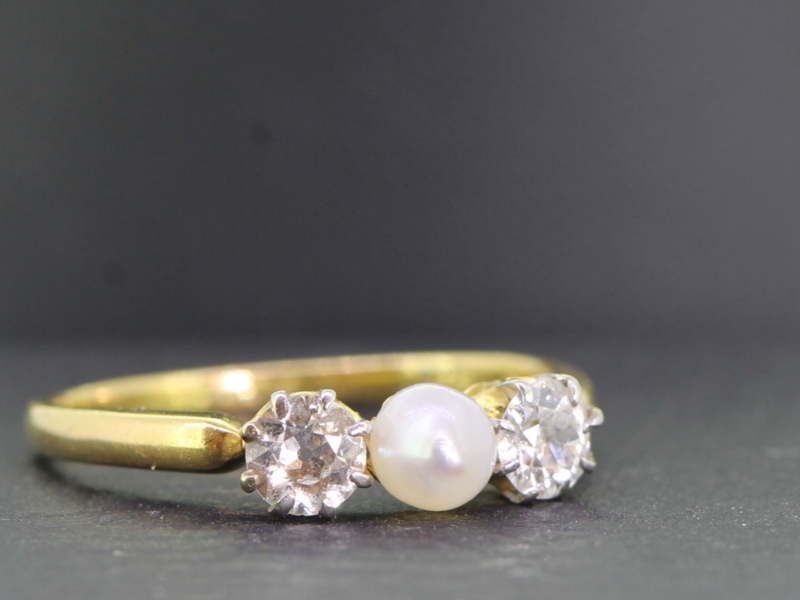 Pretty pearl and diamond trilogy 18 carat gold ring