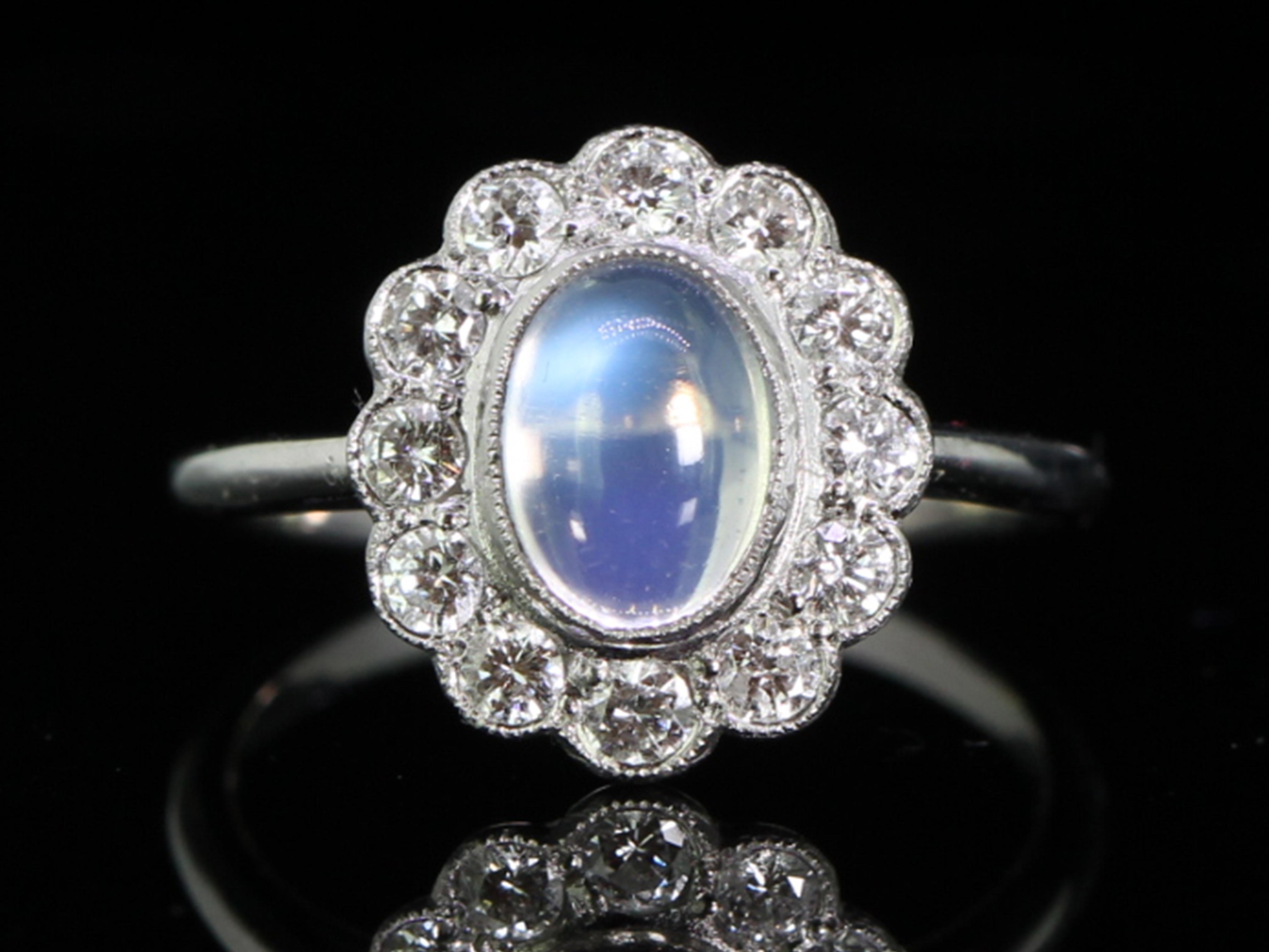 Dramantic moonstone and diamond platinum cluster ring