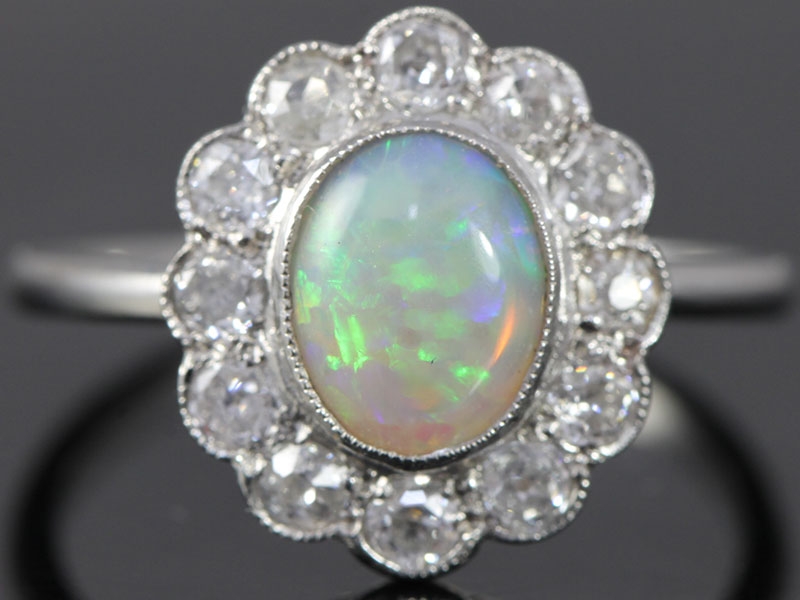 Beautiful opal and diamond platinum cluster ring