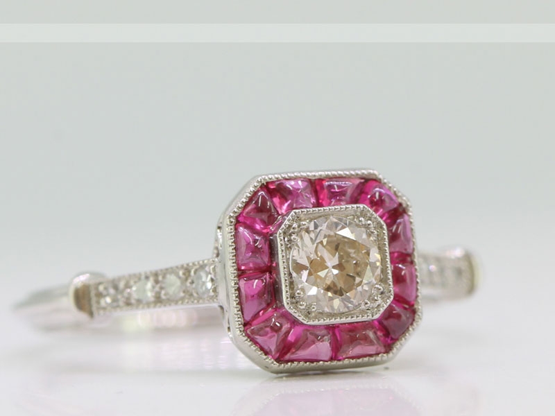 Art deco inspired diamond and ruby platinum target ring