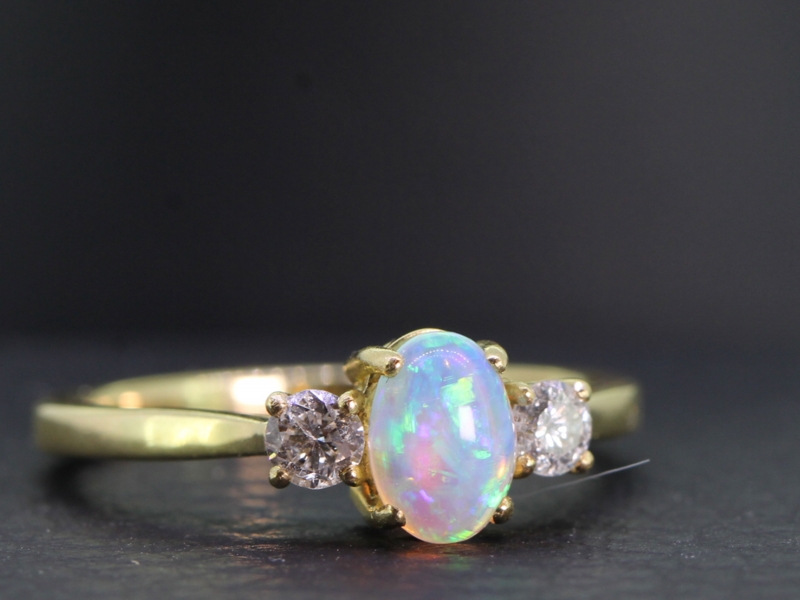 Beautiful opal and diamond three stone 18 carat gold ring
