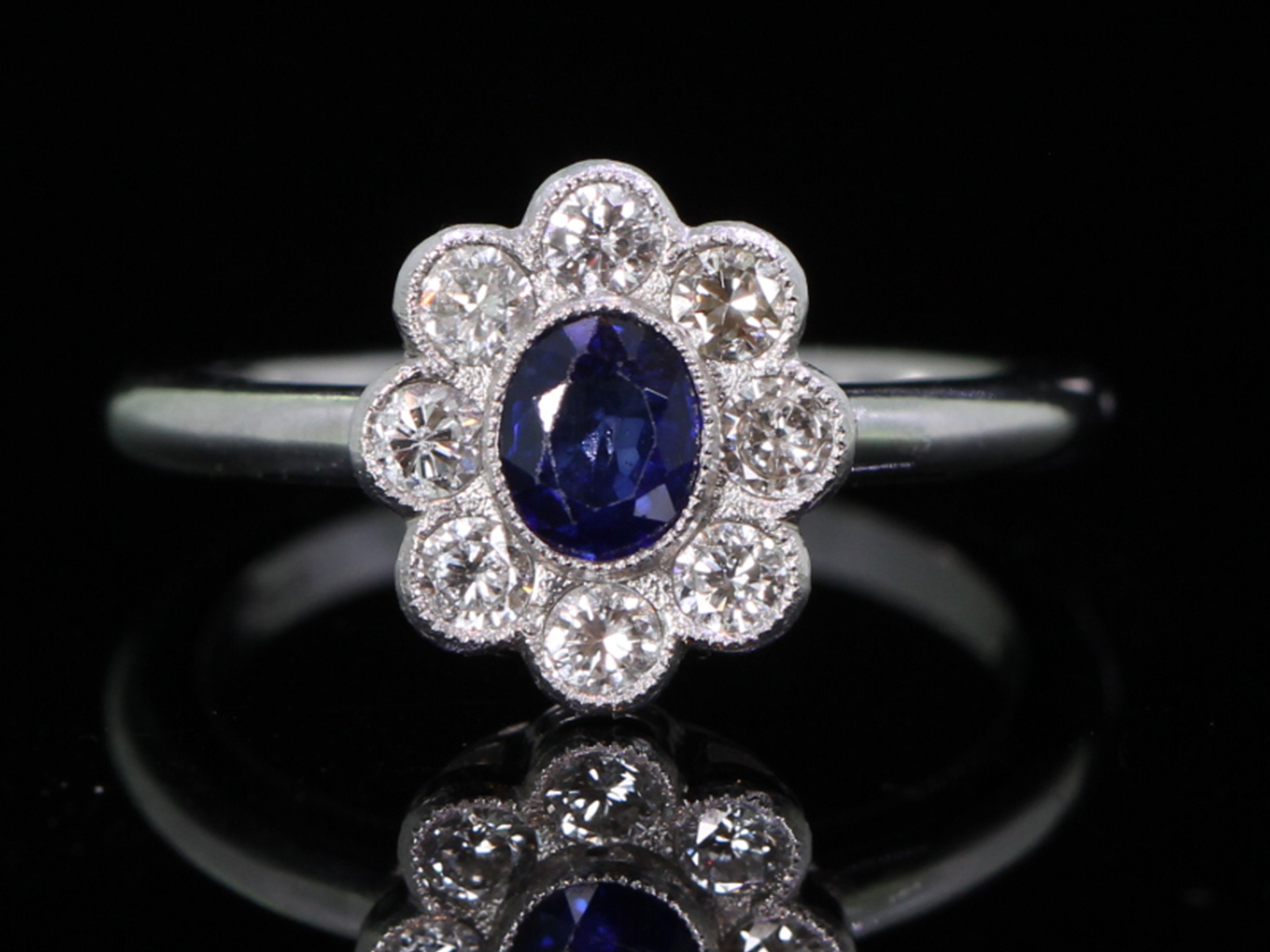 Vintage sapphire and diamond platinum cluster ring