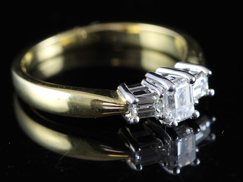 Fabulous emerald cut diamond 18 carat gold trilogy ring