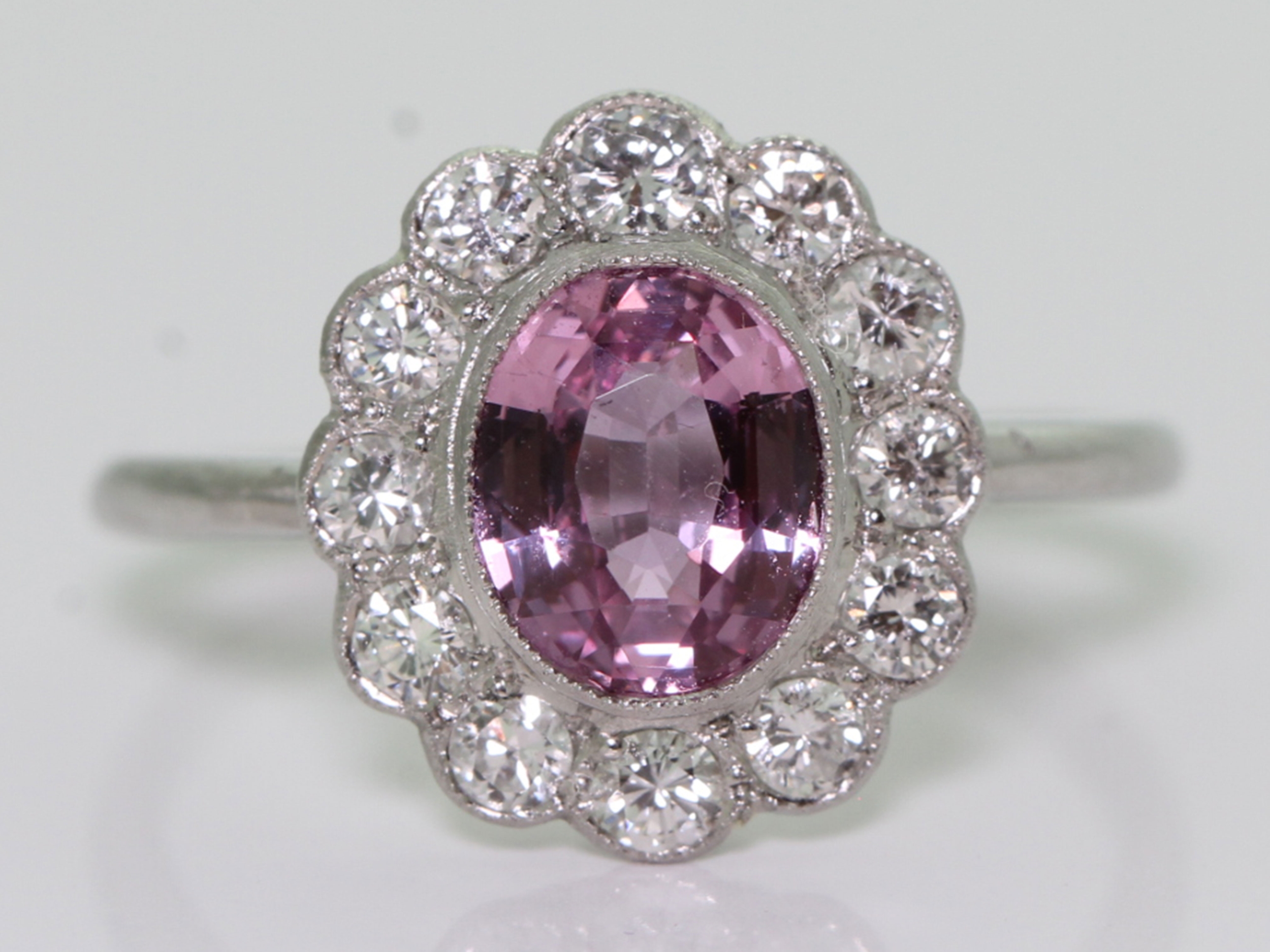 Gorgeous pink sapphire and diamond cluster platinum ring