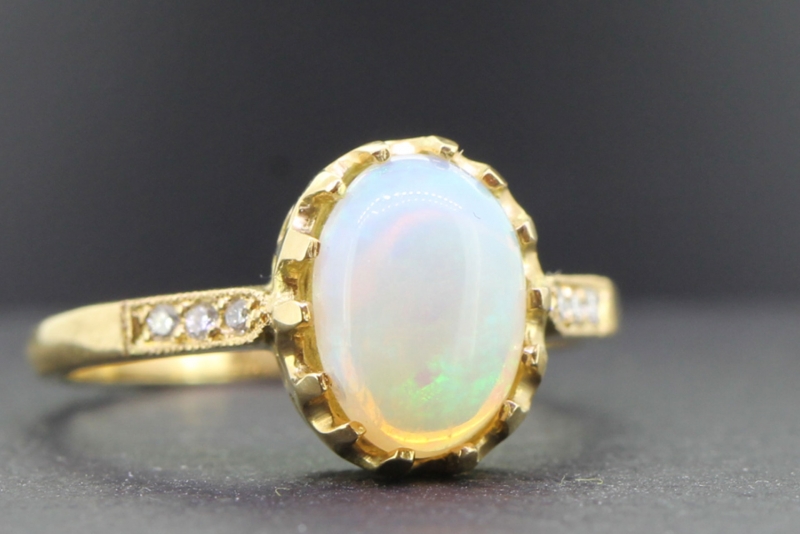 Elegant opal and diamond solitaire 18 carat gold ring