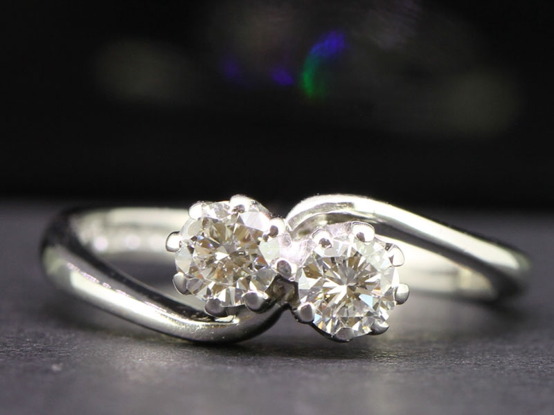   pretty two diamond on a twist in 18 carat white gold