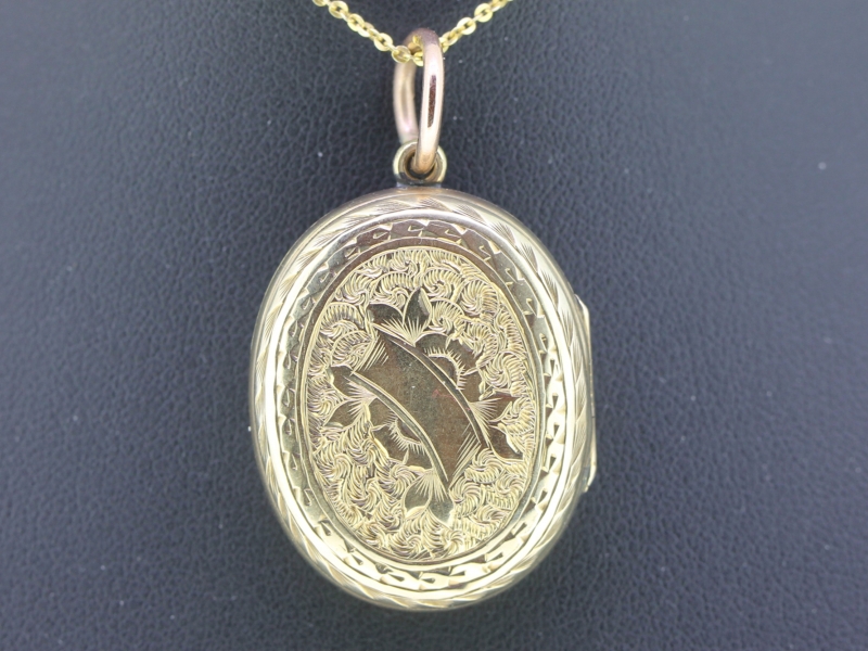  charming engraved oval 9 carat gold locket