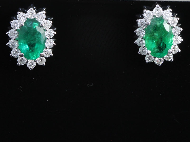 Stunning emerald and diamond 18 carat gold studs