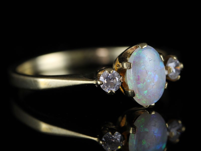 Stylish  3 stone opal and diamond 9 carat gold ring
