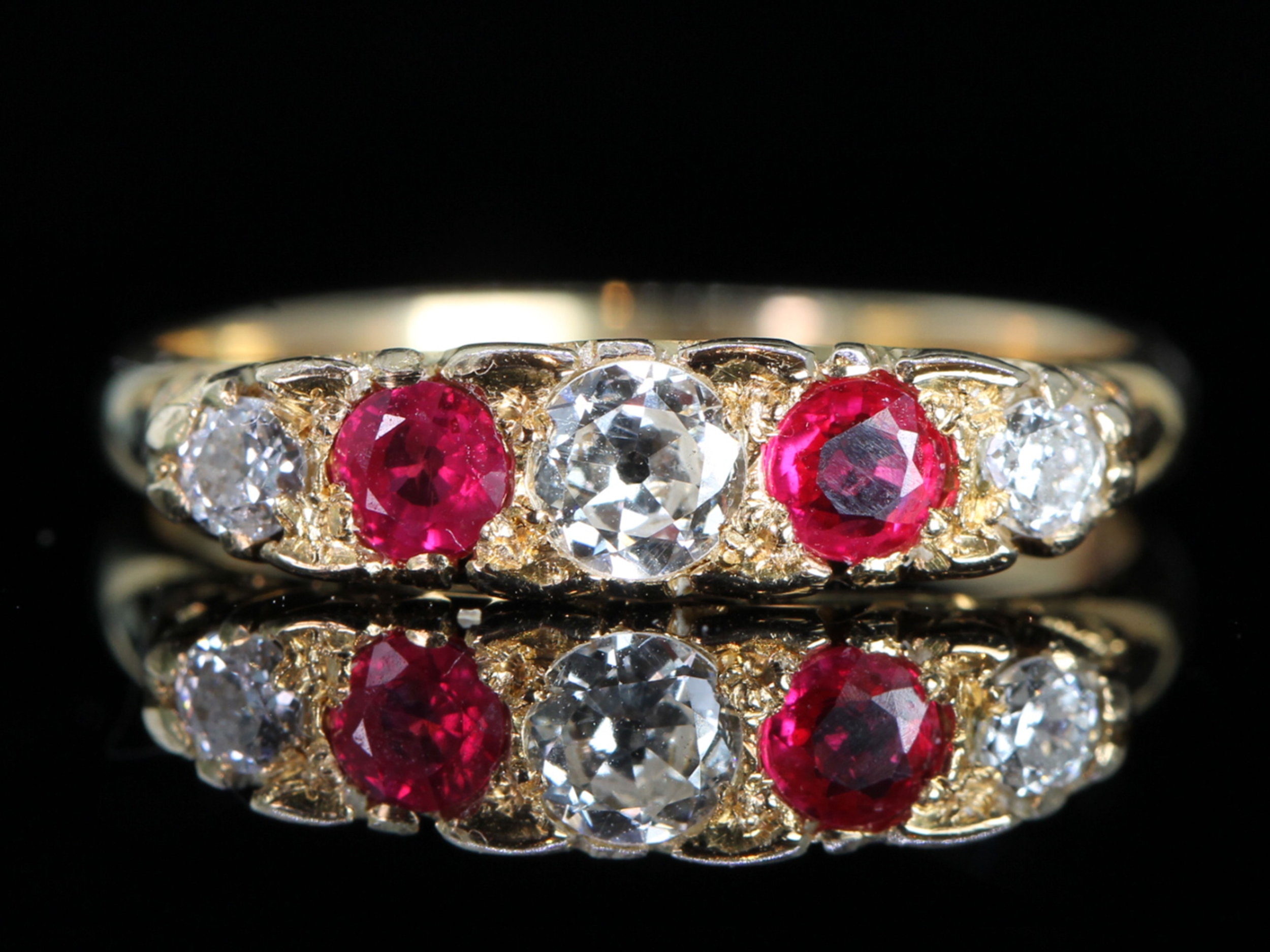 Edwardian ruby and diamond carved half hoop 18ct gold ring