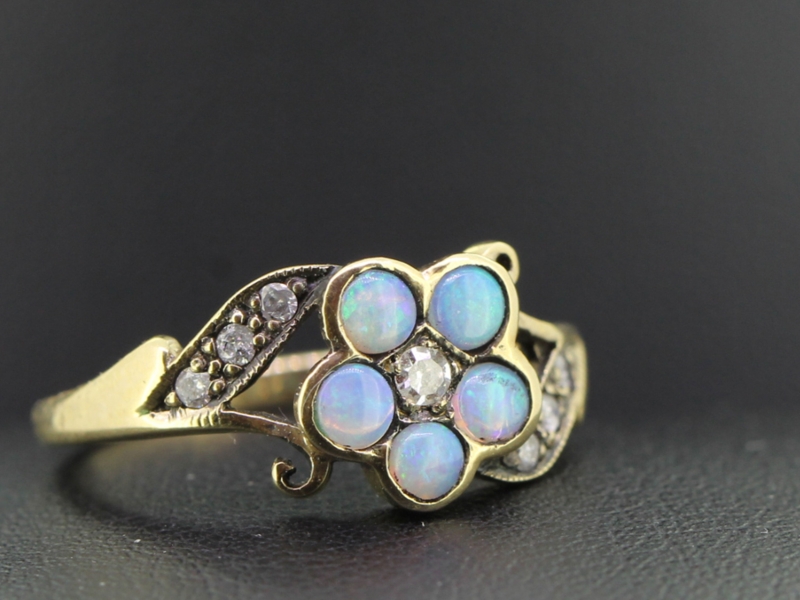 Colourful opal and diamond daisy 9 carat gold ring