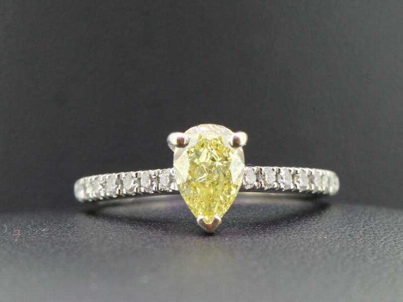 Spectacular yellow pear shaped diamond and white diamond 18 carat gold ring
