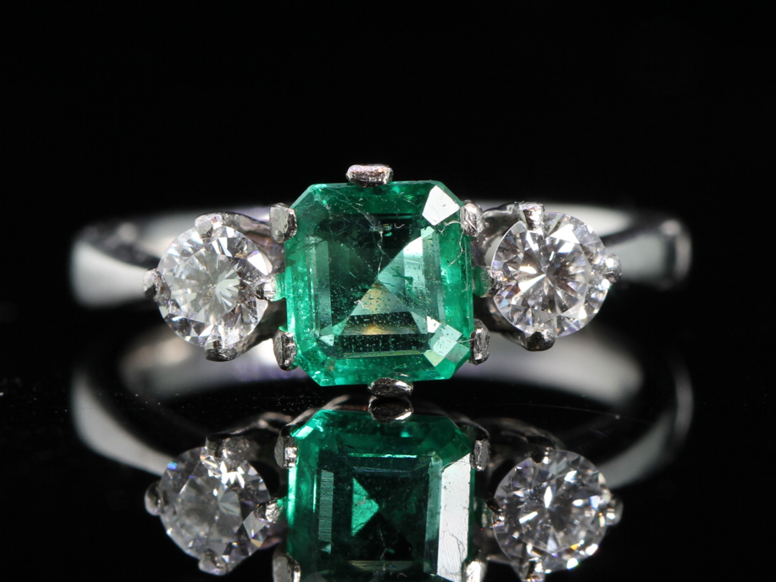 Vintage emerald and diamond trilogy platinum ring