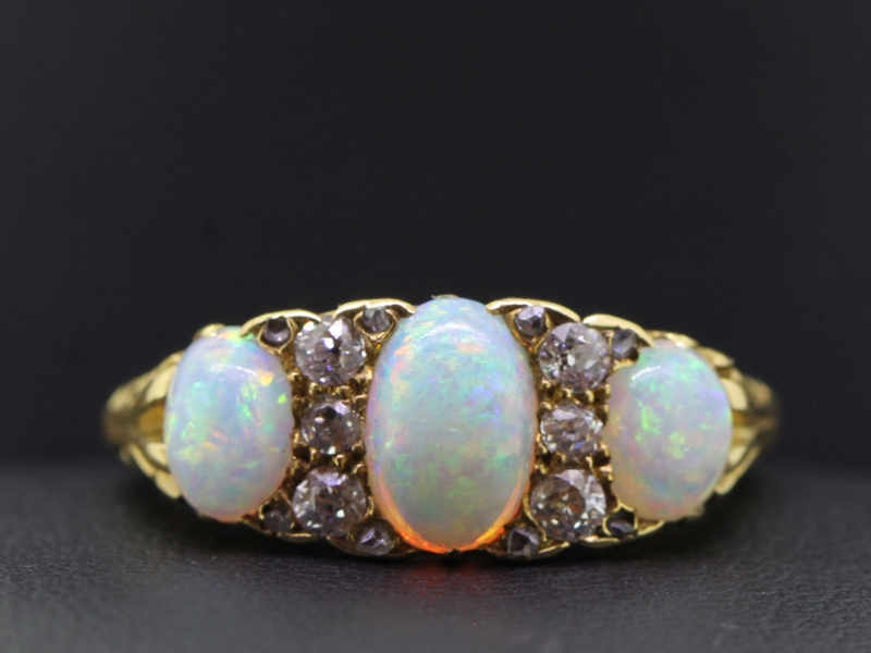 Gorgeous opal and diamond gypsy 18 carat gold ring
