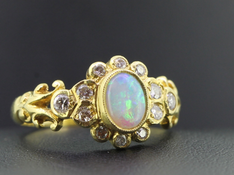 Alluring opal and diamond 18 carat gold ring
