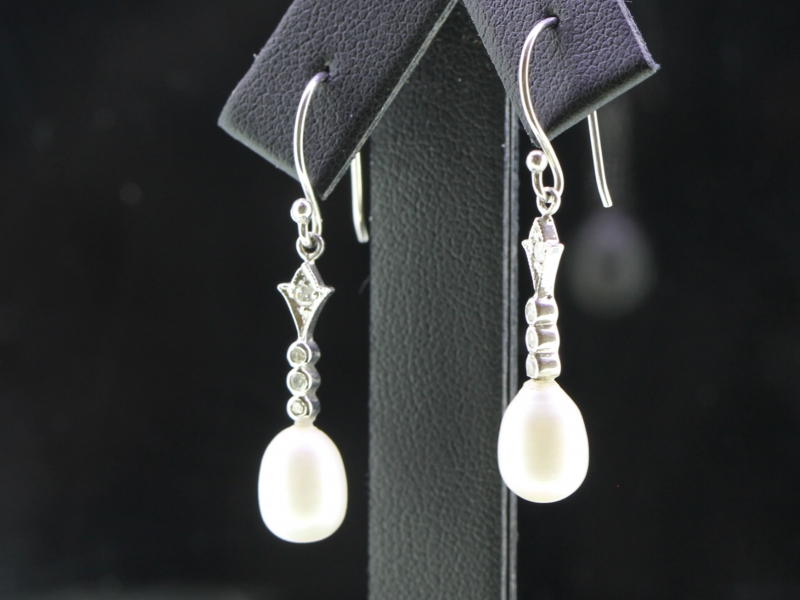 Beautiful pearl drop and diamond 18 carat gold earrings	