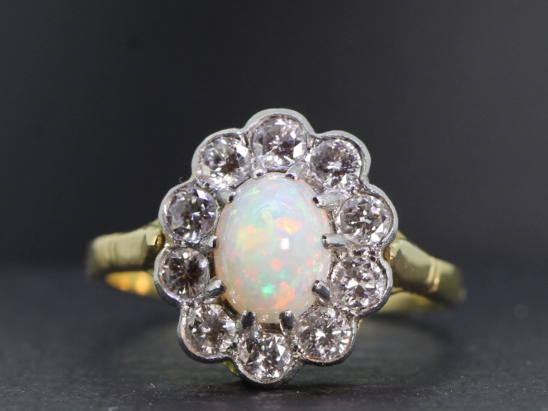 Pretty opal and diamond 18 carat gold and platinum cluster ring