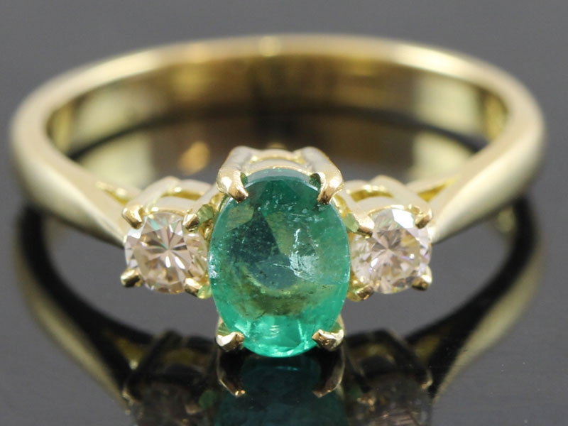  beautiful emerald and diamond 18 carat trilogy ring