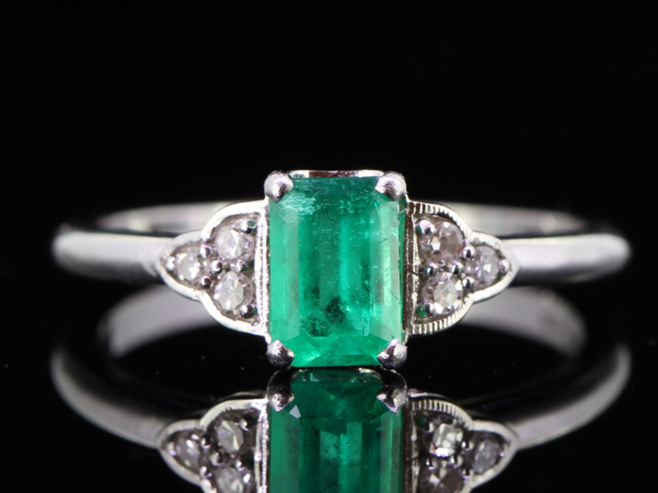 Wonderful emerald and diamond art deco inspired platinum ring 