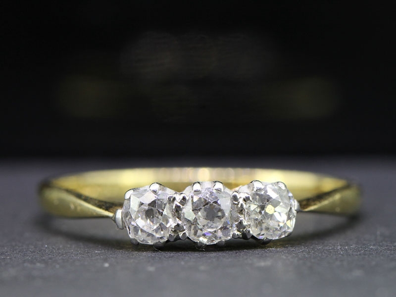 Elegant old mine cut three stone diamond 18 carat gold ring