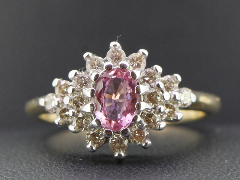 Stunning oval pink sapphire and diamond 9 carat gold cluster ring