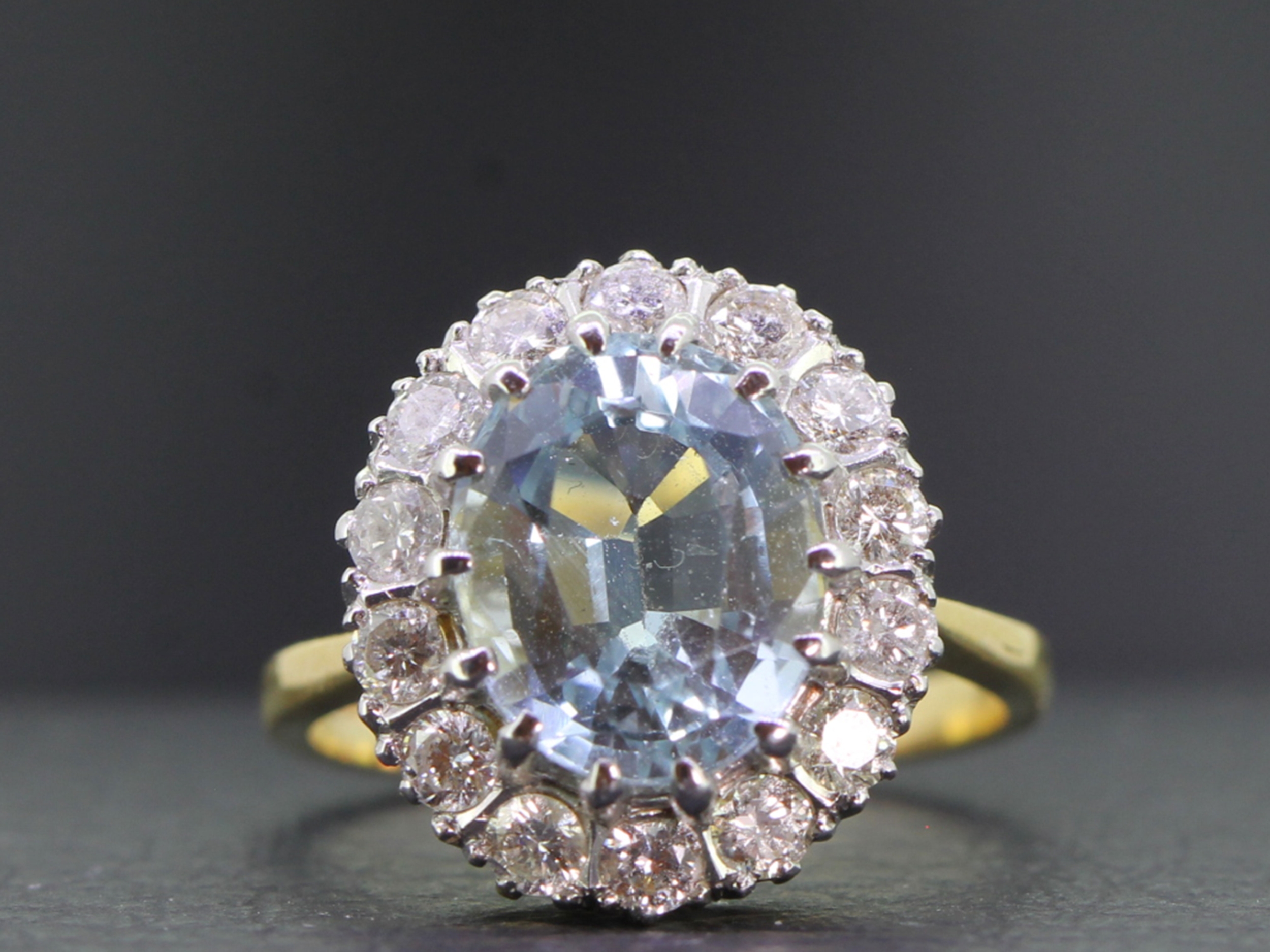 Elegant aquamarine and diamond 18 carat gold cluster ring