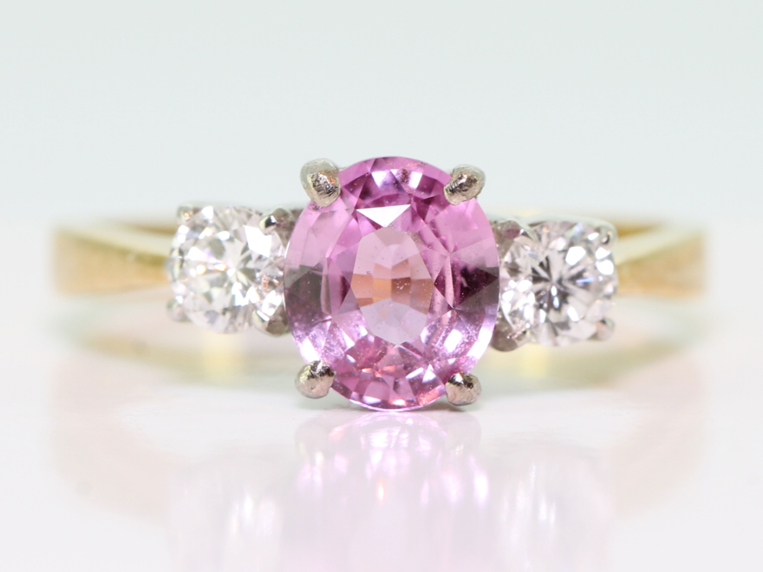 Beautiful pink sapphire and diamond 18 carat gold trilogy ring