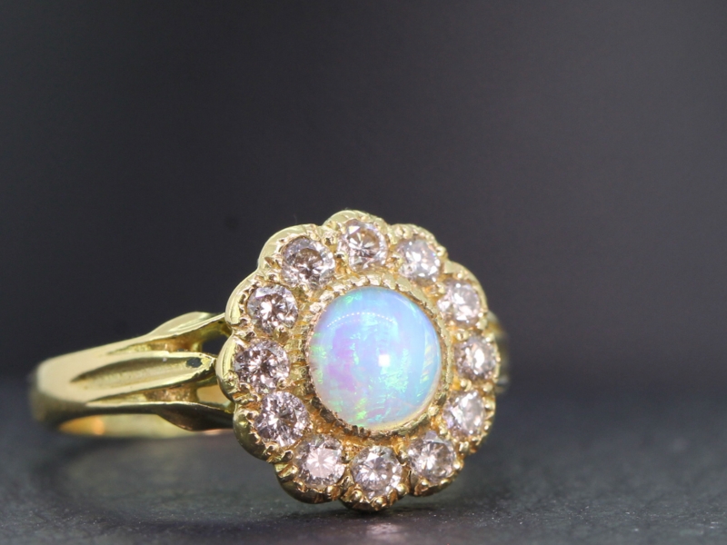  pretty opal and diamond cluster 18 carat gold ring