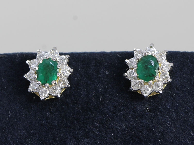 fabulous emerald and diamond 18 carat gold stud  earrings
