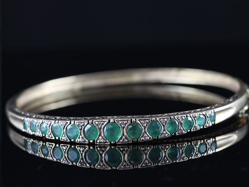 Wonderful emerald and diamond bangle handcrafted in 9 carat gold