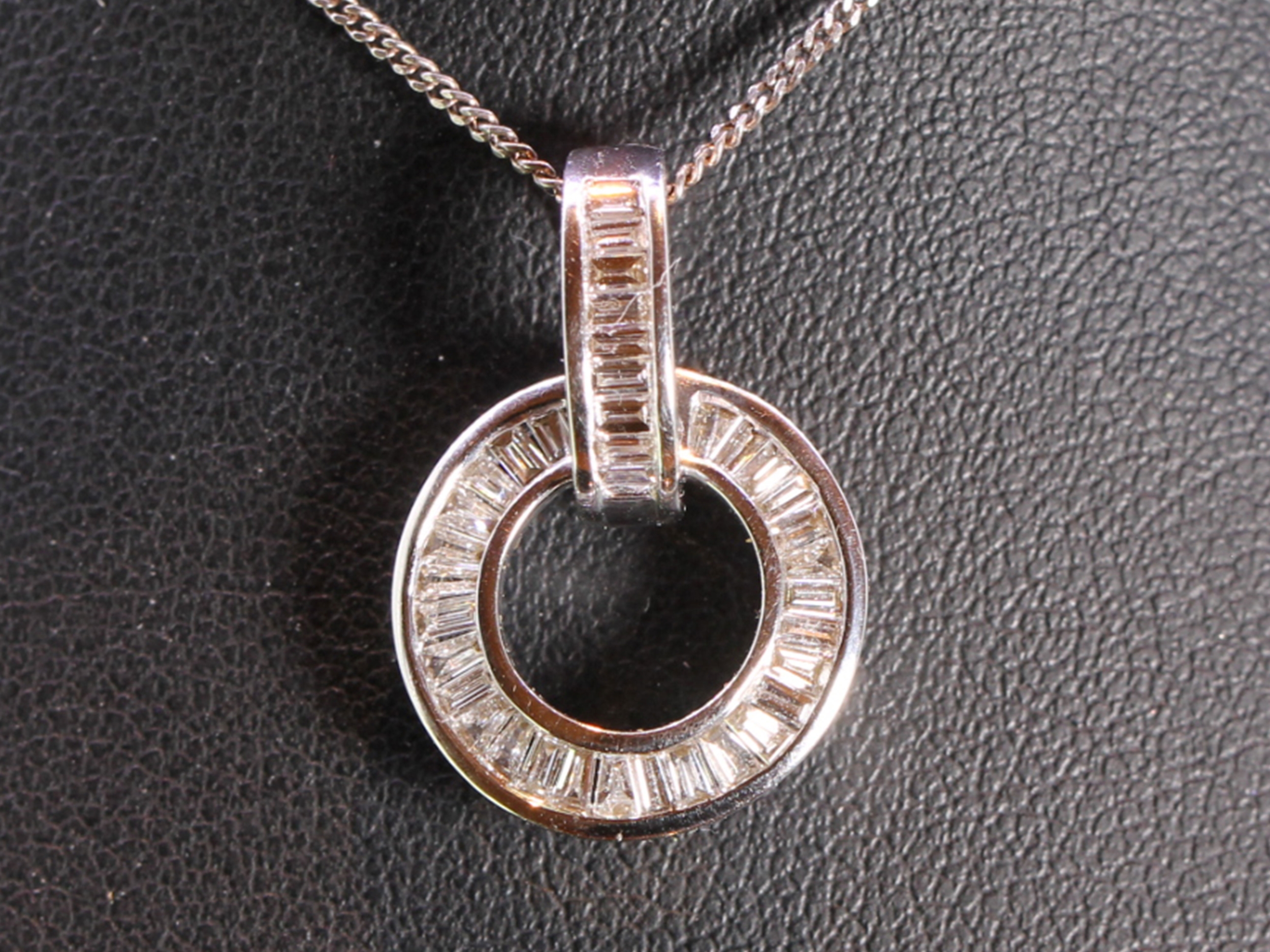Channel setting baguette diamond circular 18ct gold pendant 