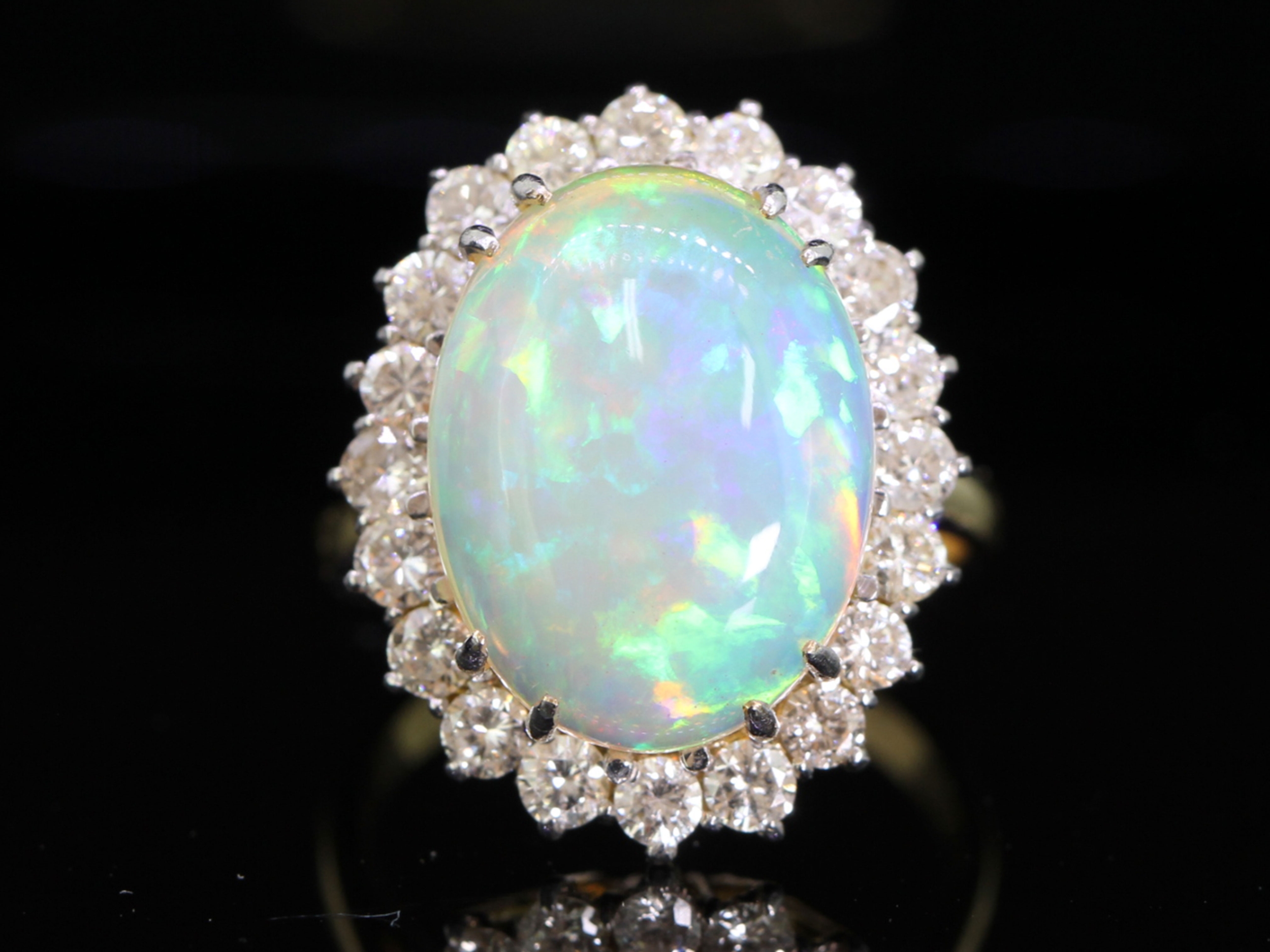 Beautiful opal and diamond 18 carat gold cluster ring