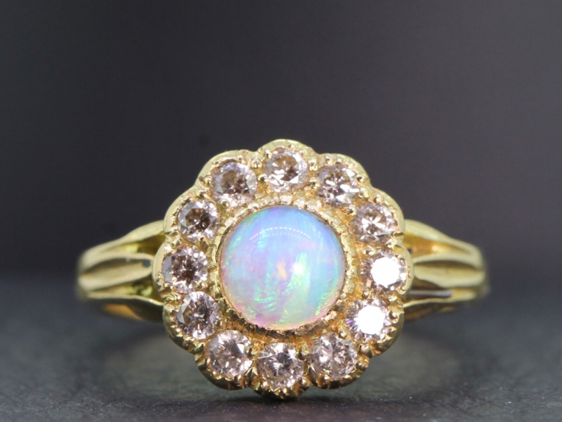  pretty opal and diamond cluster 18 carat gold ring