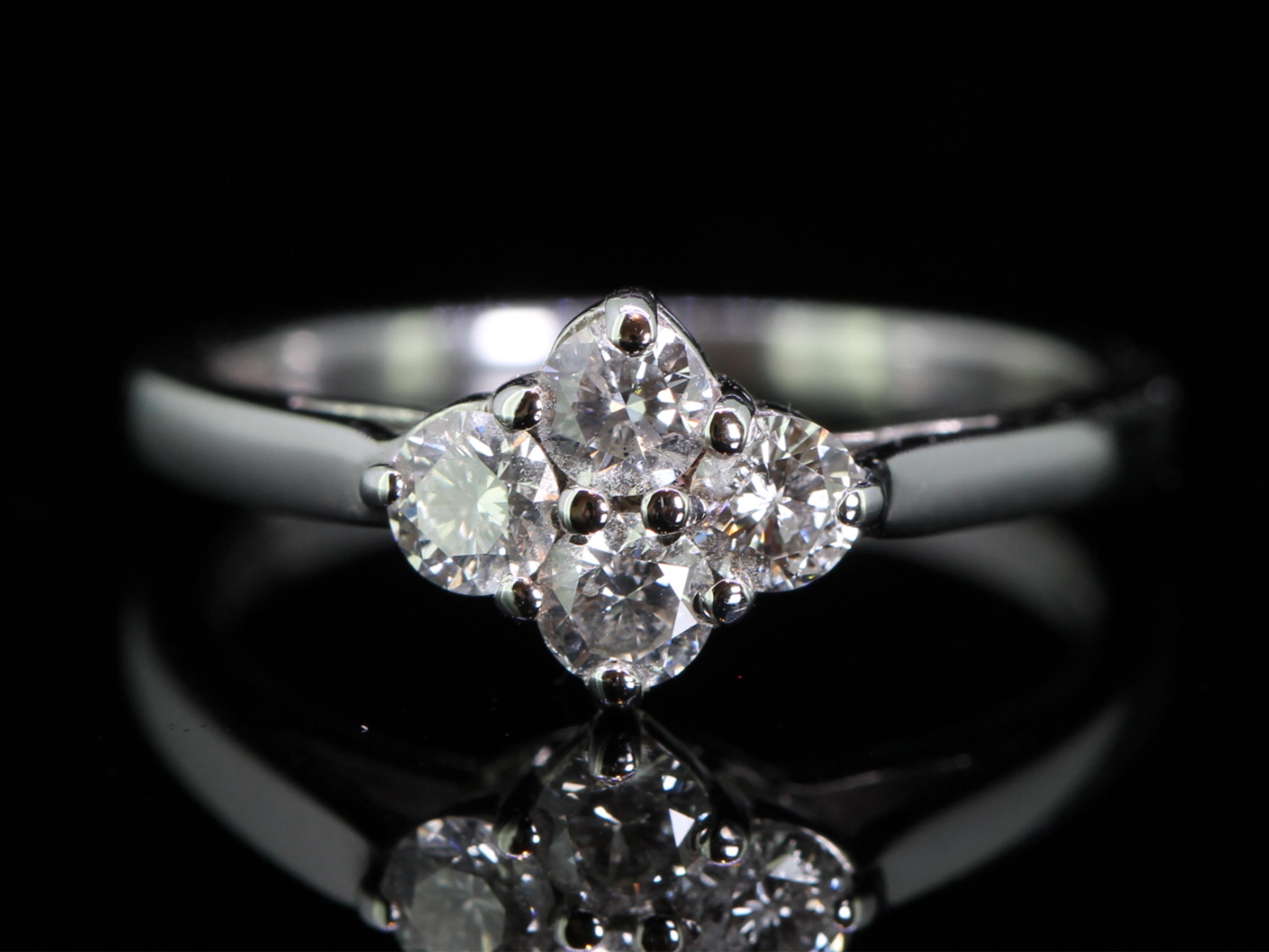Pretty four stone diamond 18 carat gold ring