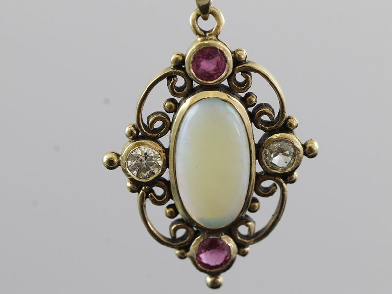 Stunning opal, ruby and diamond  9 carat gold pendant