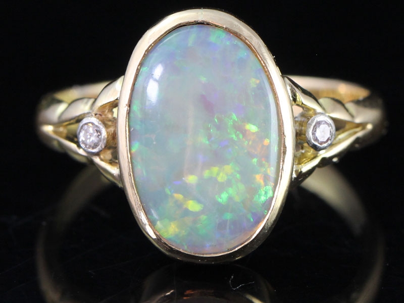 Stylish edwardian 2 carat opal and diamond 18 carat gold ring