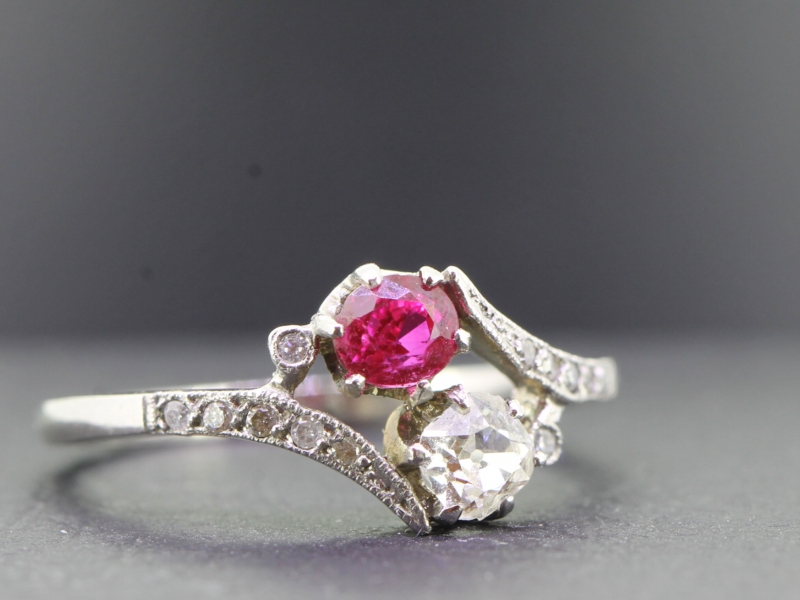 Elegant two stone diamond and ruby platinum ring on a twist 