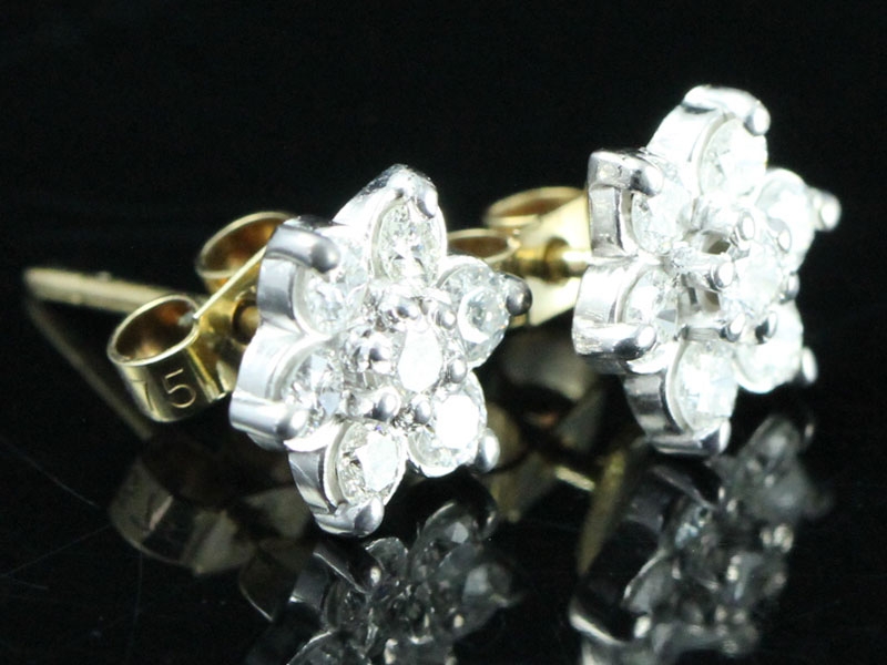  strikiing pair of diamond daisy cluster earrings 