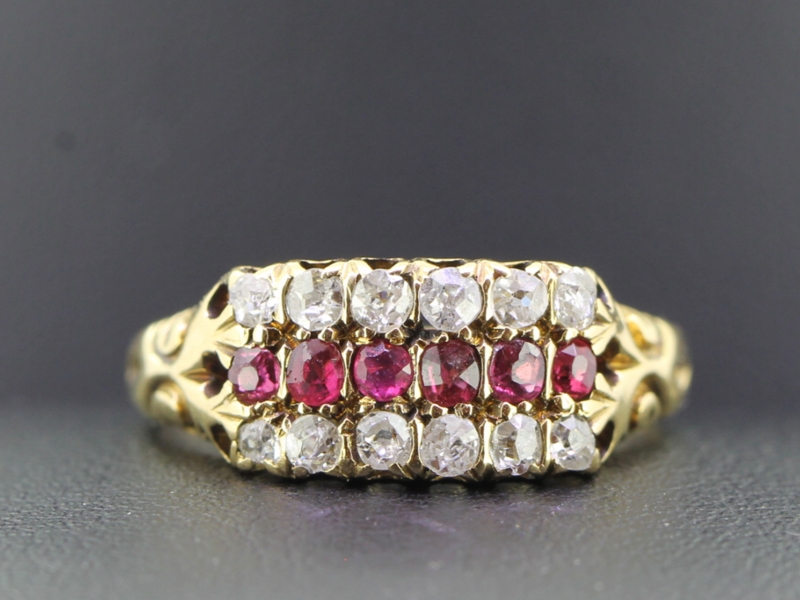 Striking ruby and diamond triple row edwardian 18 carat gold ring