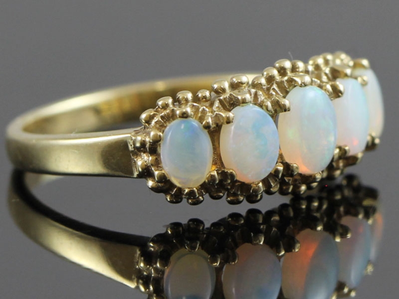 Lovley vintage inspired 9 carat 5 stone opal ring