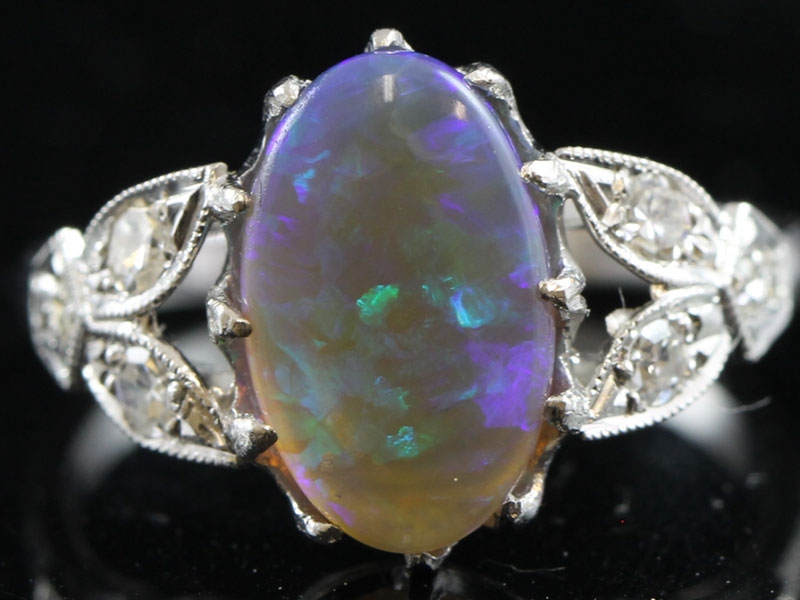 Stunning black opal and diamond 18 carat gold ring