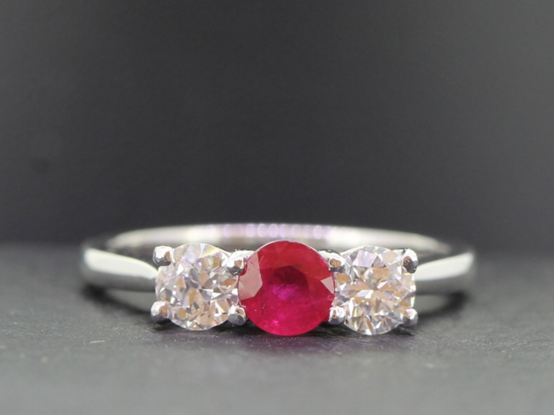 Beautiful natural ruby and diamond platinum trilogy ring