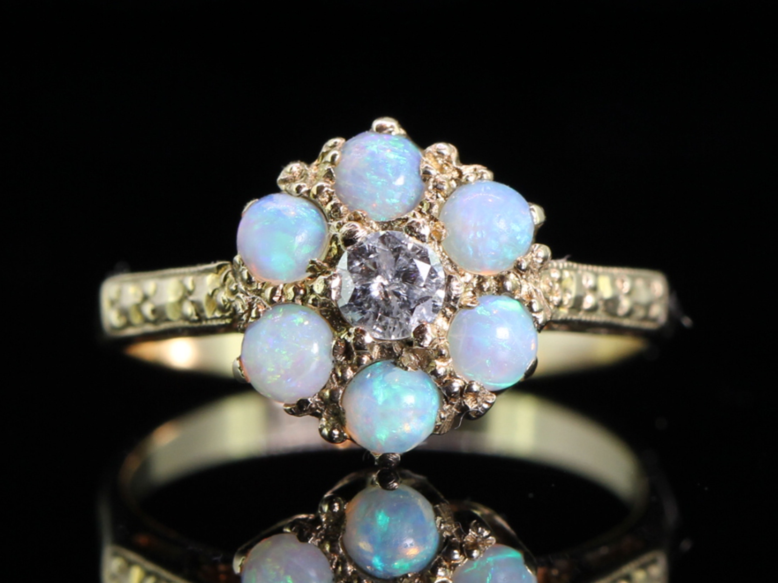 Pretty opal and diamond 9 carat gold cluster ring