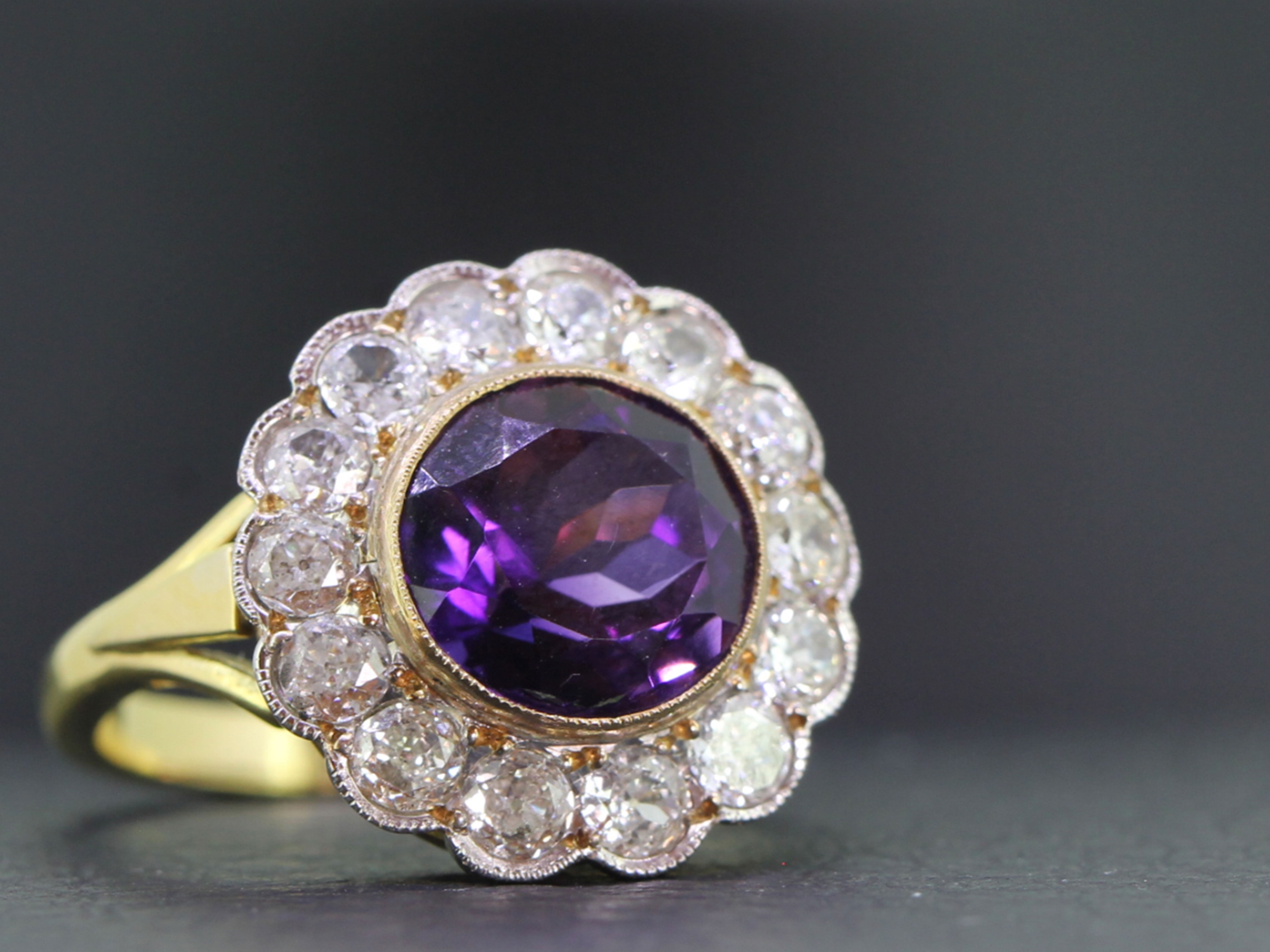 Stunning 4 carat amethyst and diamond cluster 18 carat gold ring