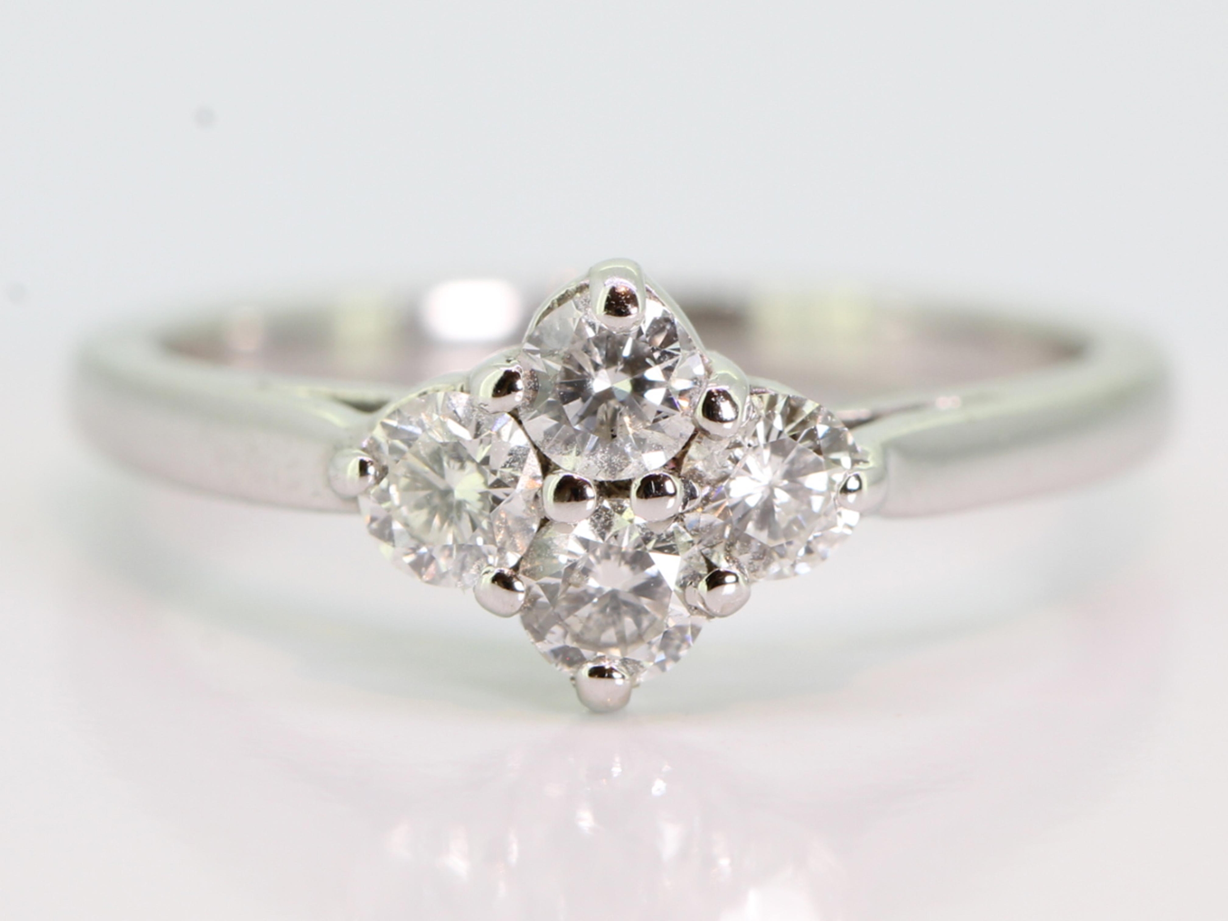 Pretty four stone diamond 18 carat gold ring