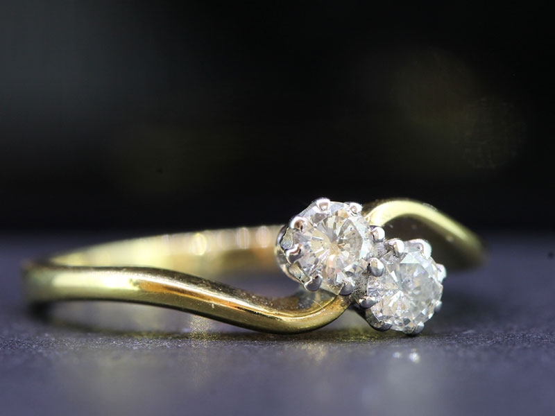 Pretty two stone diamond 18 carat gold crossover ring