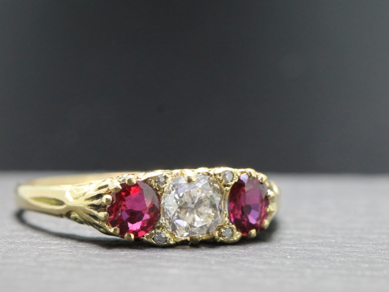 Beautiful ruby and diamond 18 carat gold carved half hoop ring