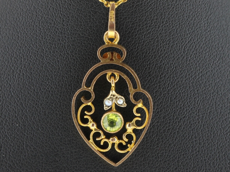 Charming peridot and pearl 9 carat gold pendant