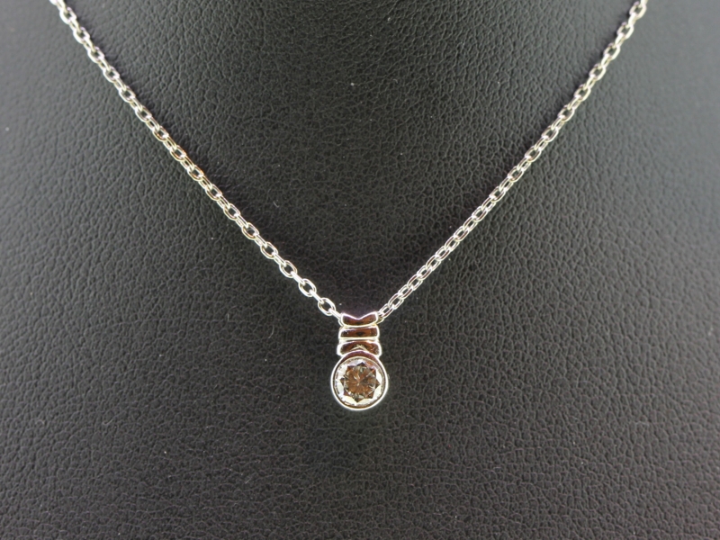 Unique diamond solitaire 18 carat gold pendant and chain